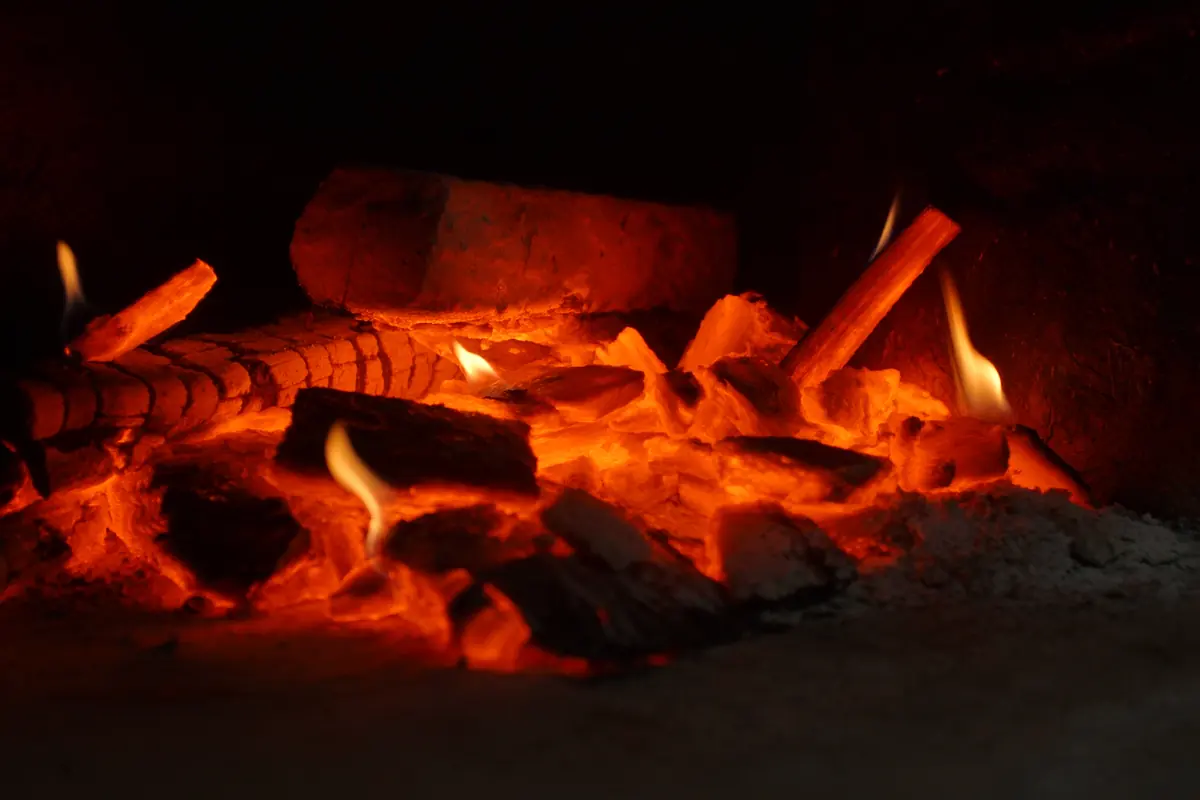 Glowing embers in the stone hearth